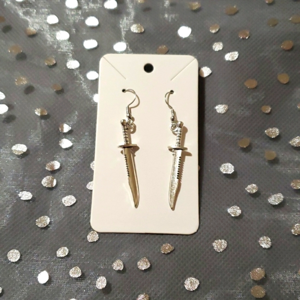Silver toned dagger earrings